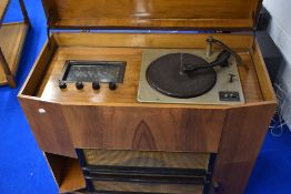 A vintage walnut cased radio gram with Collaro turntable
