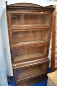 A 1920s 'The Lebus Bookcase' oak sectional/stacking bookcase with short three-quarter gallery over