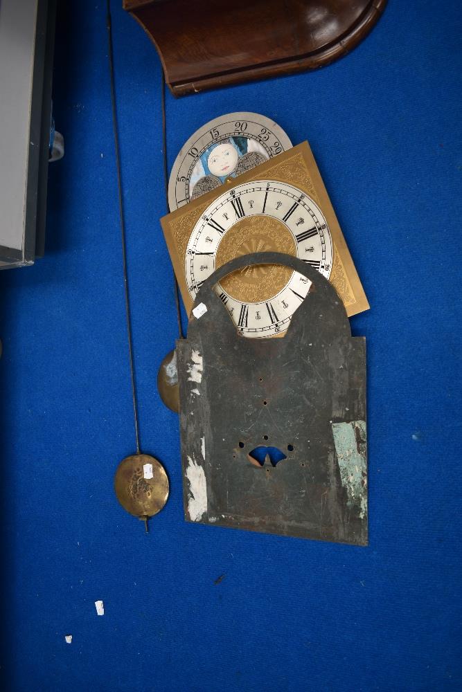 A selection of long case clock parts including figured mahogany case, faces , pendulums and - Image 2 of 4