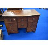 A 19th Century mahogany dressing or similar chest having bow front and Regency brass handles