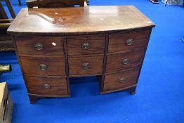A 19th Century mahogany dressing or similar chest having bow front and Regency brass handles