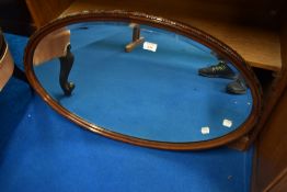 An early 20th Century mahogany oval wall mirror