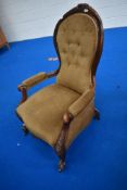 A 19th Century easy chair having scroll frame and button back dralon upholstery