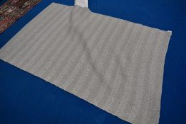 A modern rug, by Laura Ashley having pale green/ grey pattern, with orginal label and packaging,
