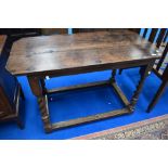 A Period oak side table in the Stuart style having canted edges on barley twist legs (been adapted