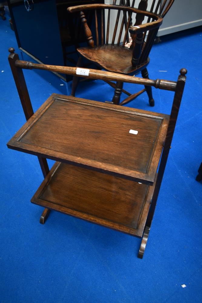 An early 20th Century oak cake stand