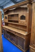 A rustic pine kitchen dresser , width approx. 214cm, height 210cm
