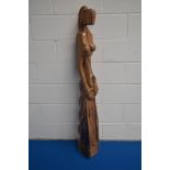 An unusual carved imported wood sculpture, of modernist design depicting a stylised partially nude