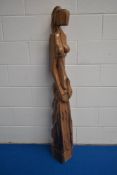 An unusual carved imported wood sculpture, of modernist design depicting a stylised partially nude