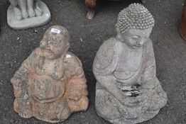 Two concrete garden ornaments , modelled as deity and buddha