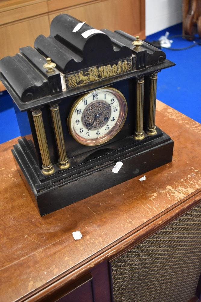 A Victorian black slate mantel clock