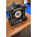 A Victorian black slate mantel clock