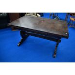 A Priory style oak drawer leaf refectory style dining table, probably Ercol