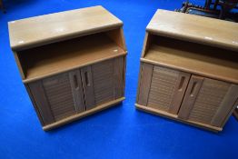 A pair of matching beech bed side cabinets.