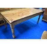 A modern pine kitchen dining table, in the traditional farmhouse style, approx. 183 x 89cm