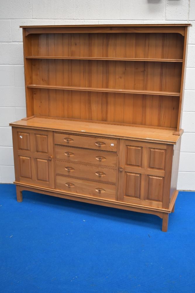 A craftsman made ash dresser, of traditional arrangement with two-tier plate rack, over the oblong