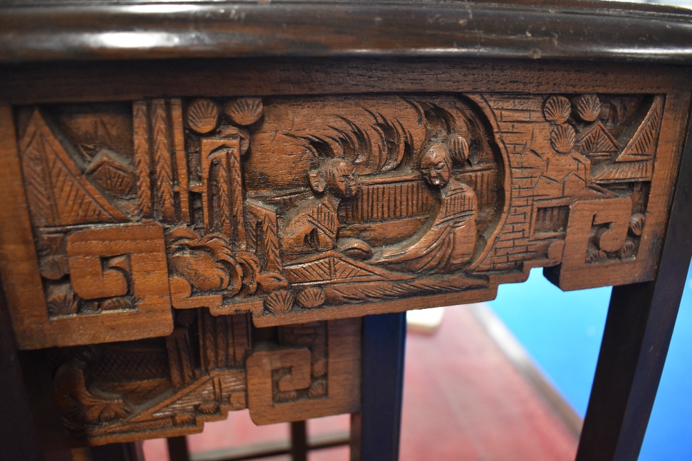 An Oriental nest of three tables with carvings to frieze and under glass to top - Image 2 of 3