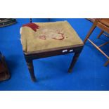 A 19th Century mahogany framed dressing table stool having drop in tapestry seat