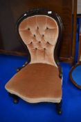 A Victorian mahogany framed nursing chair having later button back upholstery