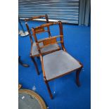 A pair of reproduction Regency yew effect dining chairs