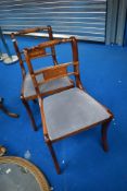 A pair of reproduction Regency yew effect dining chairs