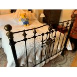 A reproduction Victorian style brass and cast double bed frame (linen and mattress not included)