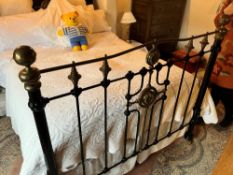 A reproduction Victorian style brass and cast double bed frame (linen and mattress not included)