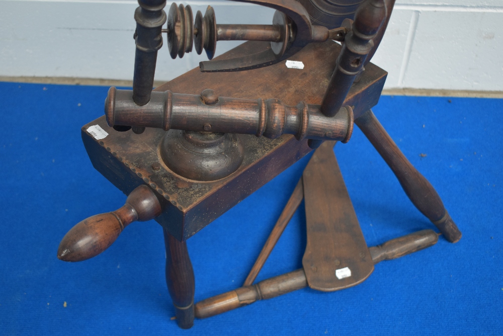 A 19th century spinning wheel, with notch carved block, turned supports and rails, the wheel with - Image 3 of 3