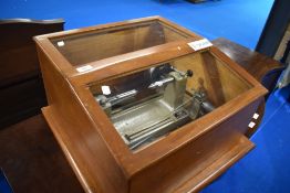 A vintage Matrix diameter measuring machine, in stained frame and glazed case
