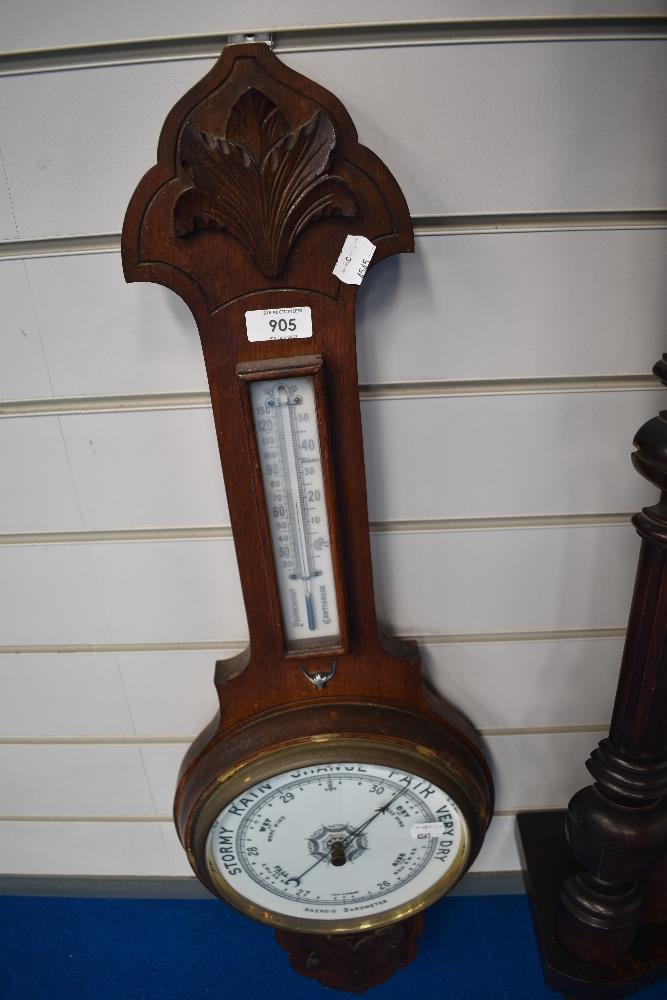 A banjo form barometer with enamel dial,