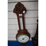 A banjo form barometer with enamel dial,