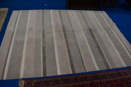 A modern rug, cream stripe pattern , approx 240 x 173cm