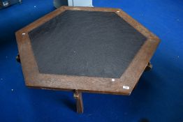 A mid century style hexagonal coffee table with slate effect top.