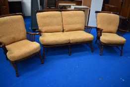 A nice quality reproduction oak cottage suite comprising spindle back settee and two chairs, with