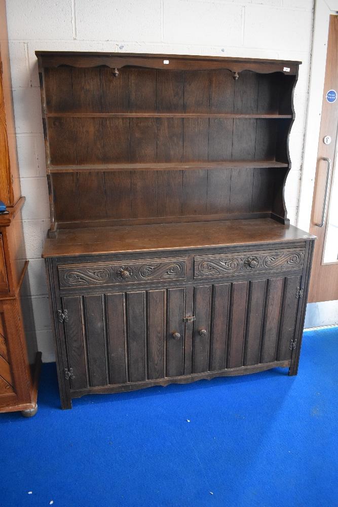 A vintage priory style oak dresser