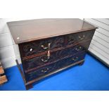 A 19th Century mahogany chest of two over two drawers, having carved foliate scroll decoration and