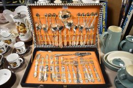 A vintage canteen of stainless steel cutlery with moulded handles.