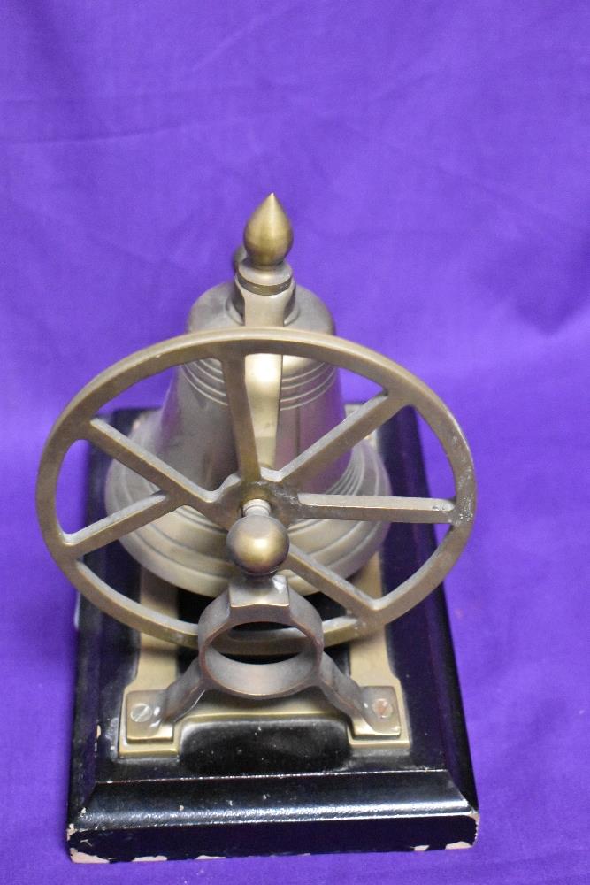 A solid brass and mounted table top ship's bell raised on a stepped rectangular plinth, 18cm tall - Image 2 of 2