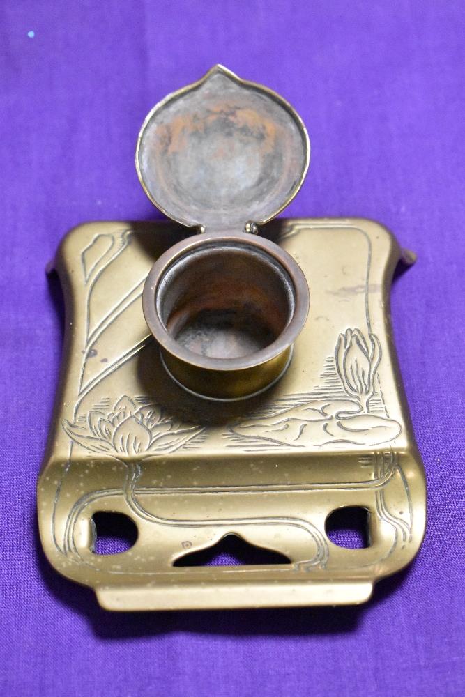 A small brass inkwell pen rest - Image 2 of 2