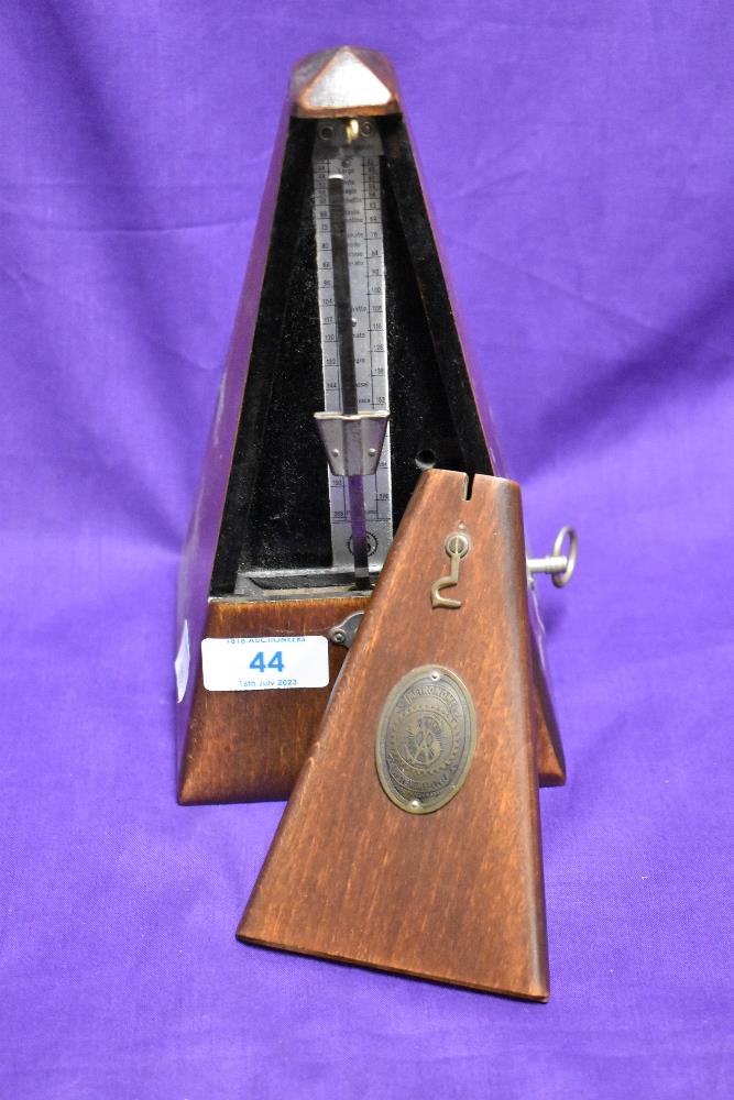 A traditional stained frame metronome , bearing makers brass plaque for System Maelzel, Germany