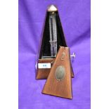 A traditional stained frame metronome , bearing makers brass plaque for System Maelzel, Germany