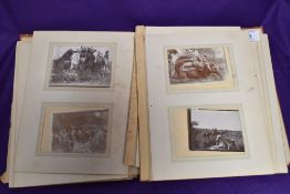 A 19th/20th Century photograph album with various assorted photographs illustrating visits to