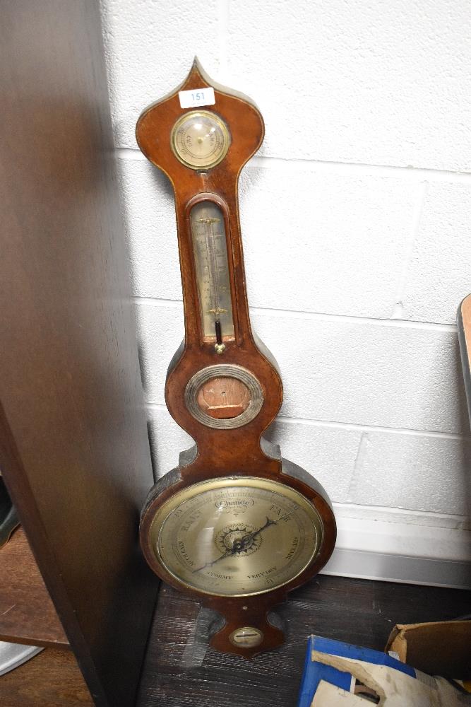 An early 20th century onion topped barometer, having inlaid detailing, AF.