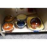 An assortment of casserole dishes and a oven dish, including Denby stoneware.