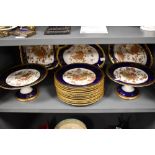 A selection of late 19th Century W A Adderley and Co tableware comprising 12 dining plates, 2 tazzas