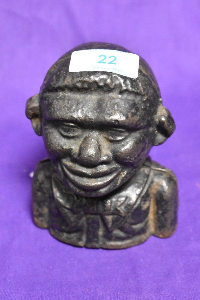 An early 20th Century cast iron novelty money bank in the form of a Jolly man