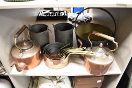 A brass jam pan, two copper kettles, Two Billy cans and a set of graduated copper pans with brass