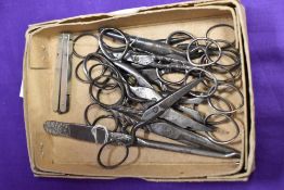 A selection of vintage seamstress or needlework scissors, button hook etc
