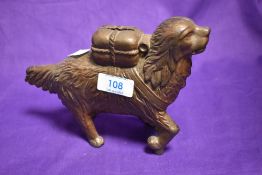 A vintage cast metal penny bank , modelled as a St Bernard rescue dog.