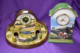 Two modern train themed clocks